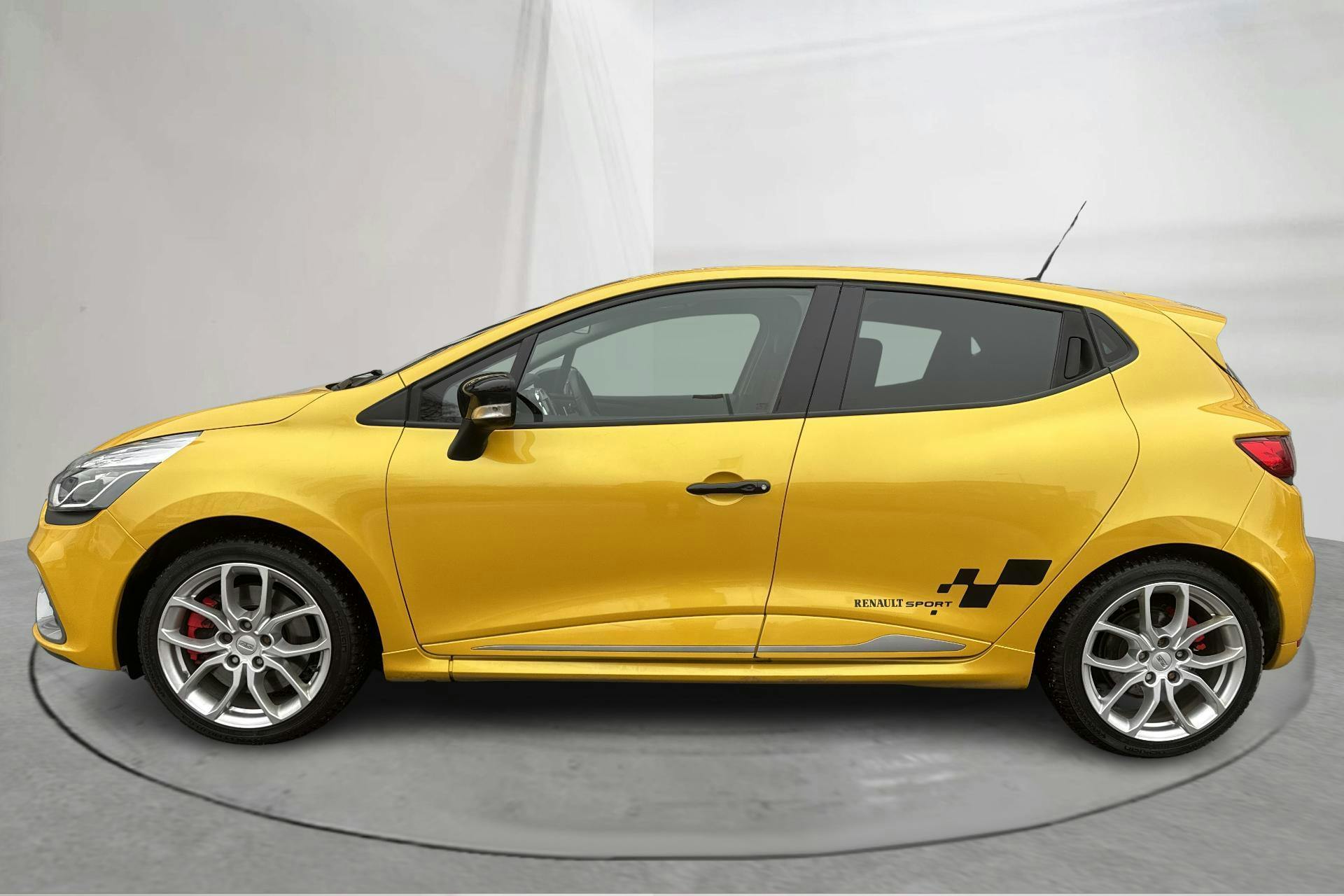 Presentation photo 2 of 18: Renault Clio IV R.S. 200 (200hk) - 47 890 km - Automatic - yellow - 2014