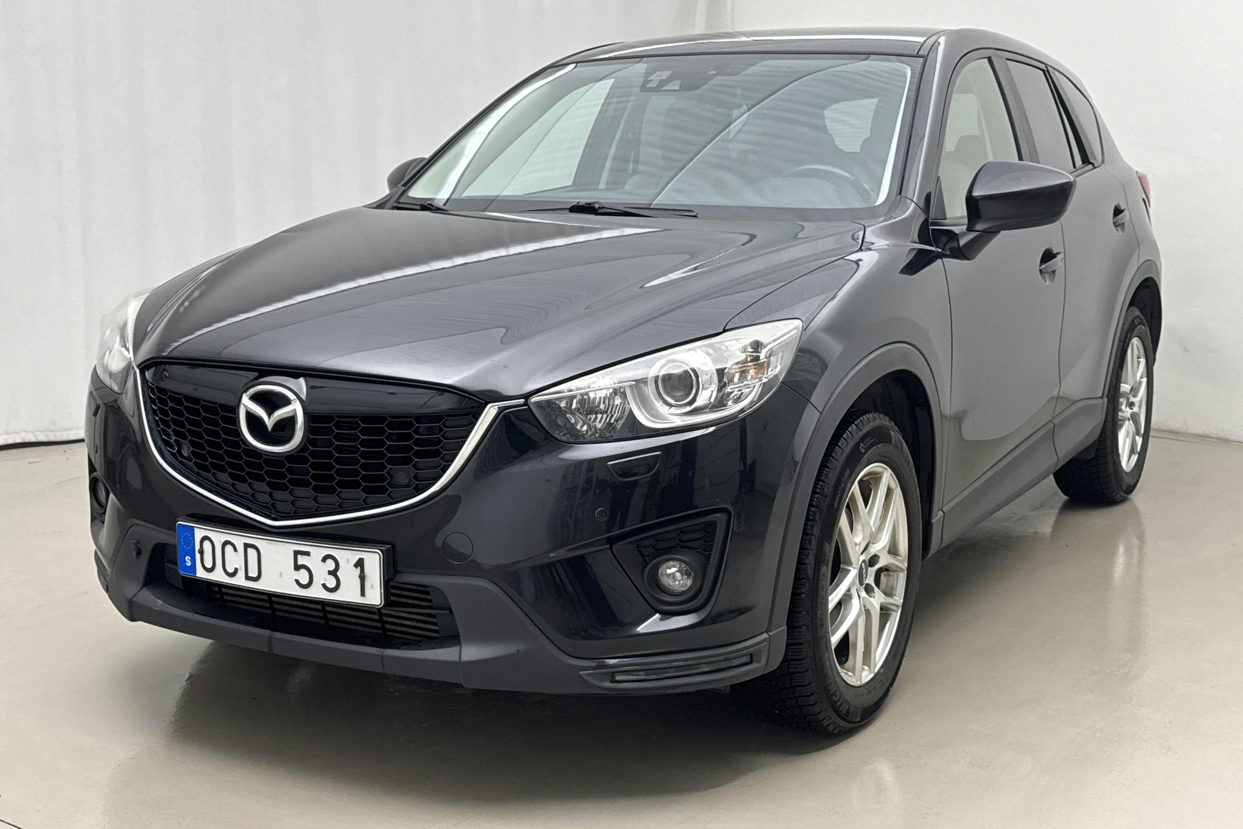 Präsentationsfoto 1 von 14: Mazda CX-5 2.2 DE AWD (175hk) - 161 680 Kilometer - Verkaufsautomat - Schwarz - 2014
