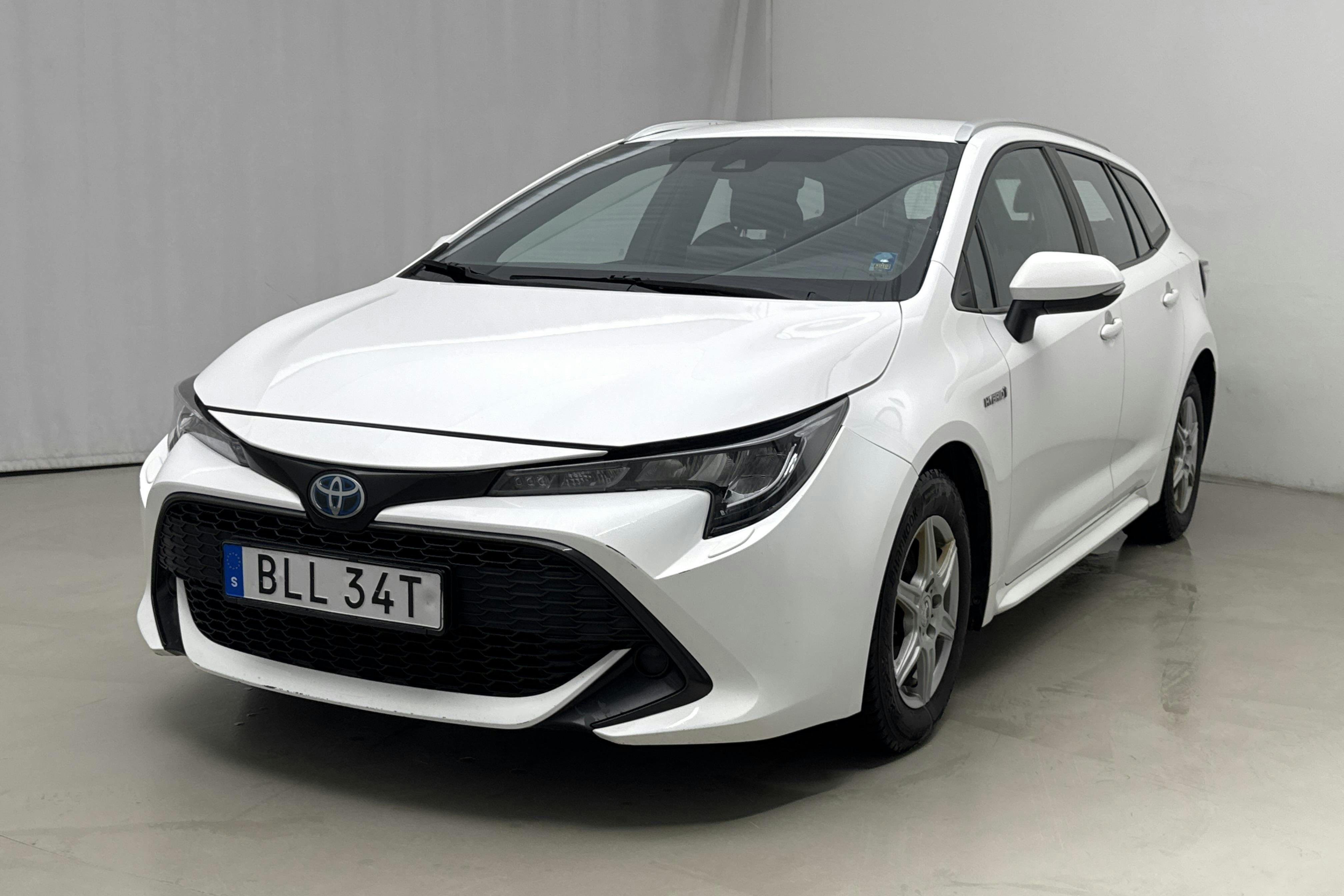 Præsentationsfoto 1 af 16: Toyota Corolla 1.8 Hybrid Touring Sports (122hk) - 181 210 kilometer - Salgsautomat - Hvid - 2020