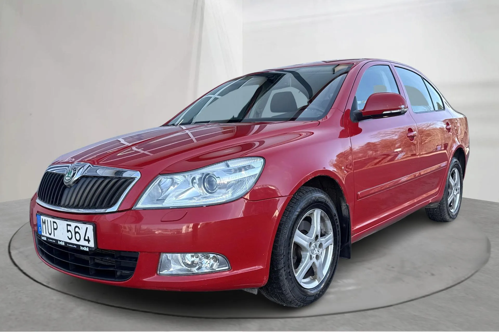 Presentation photo 1 of 14: Skoda Octavia II 1.6 TDI GreenLine (105hk) - 249 880 km - Manual - red - 2013
