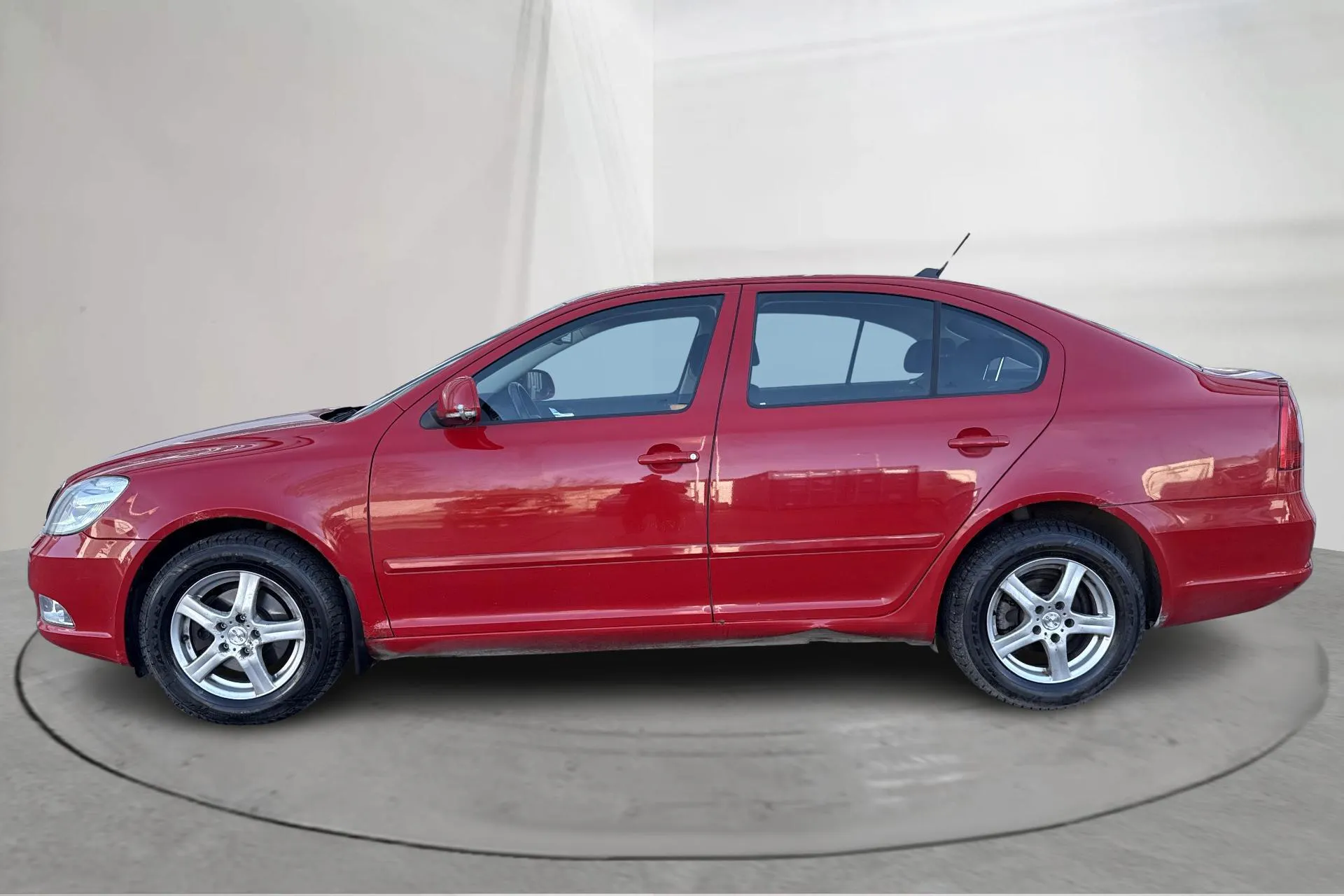 Presentation photo 2 of 14: Skoda Octavia II 1.6 TDI GreenLine (105hk) - 249 880 km - Manual - red - 2013