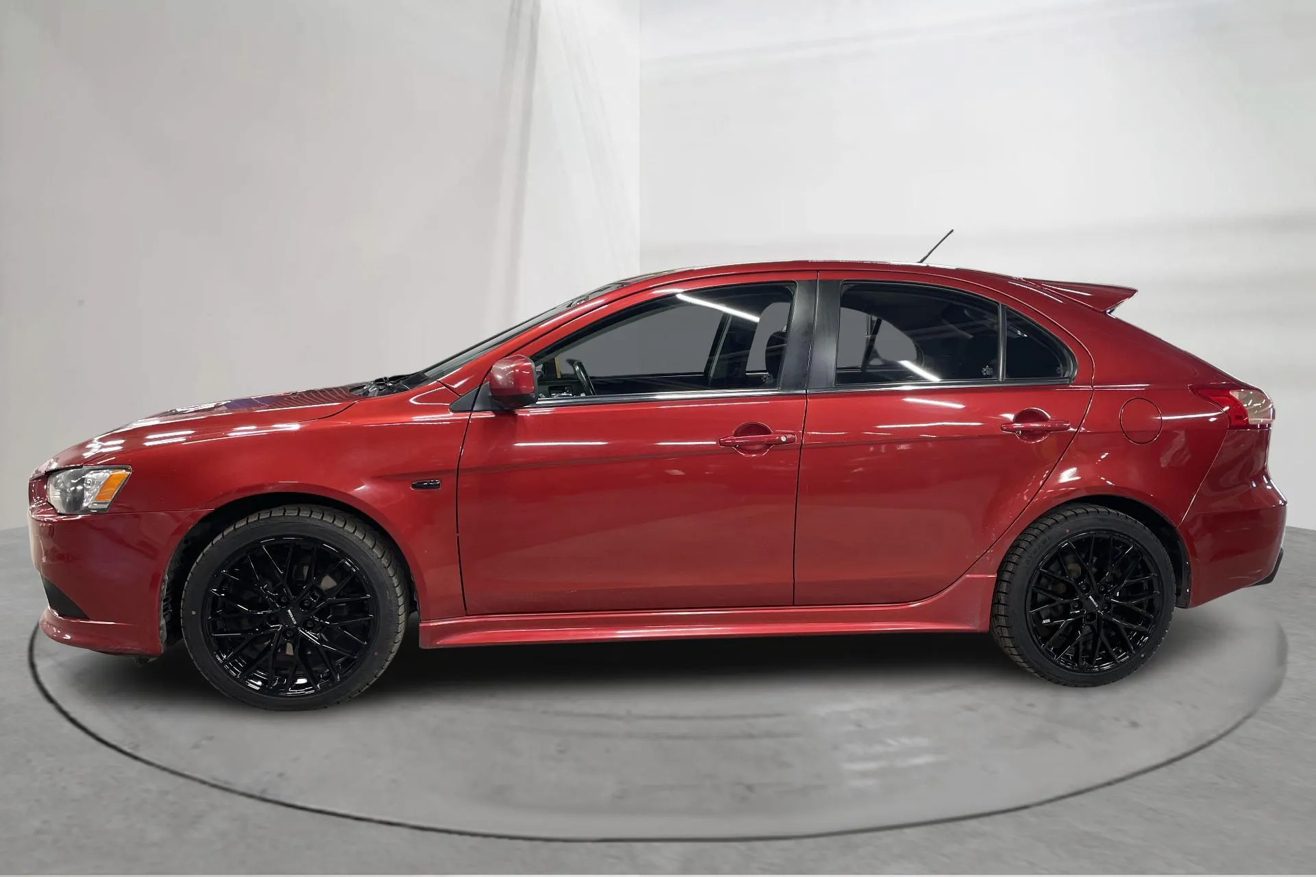 Presentationsfoto 2 av 14: Mitsubishi Lancer 2.0 Turbo Ralliart (240hk) - 14 562 mil - Automat - Dark Red - 2010
