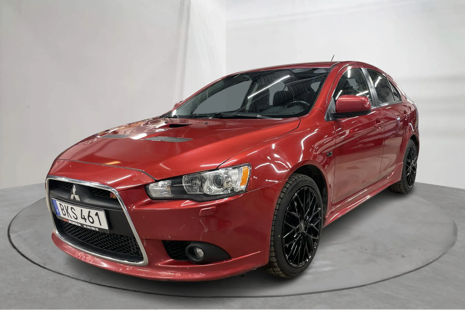 Presentationsfoto 1 av 14: Mitsubishi Lancer 2.0 Turbo Ralliart (240hk) - 14 562 mil - Automat - Dark Red - 2010