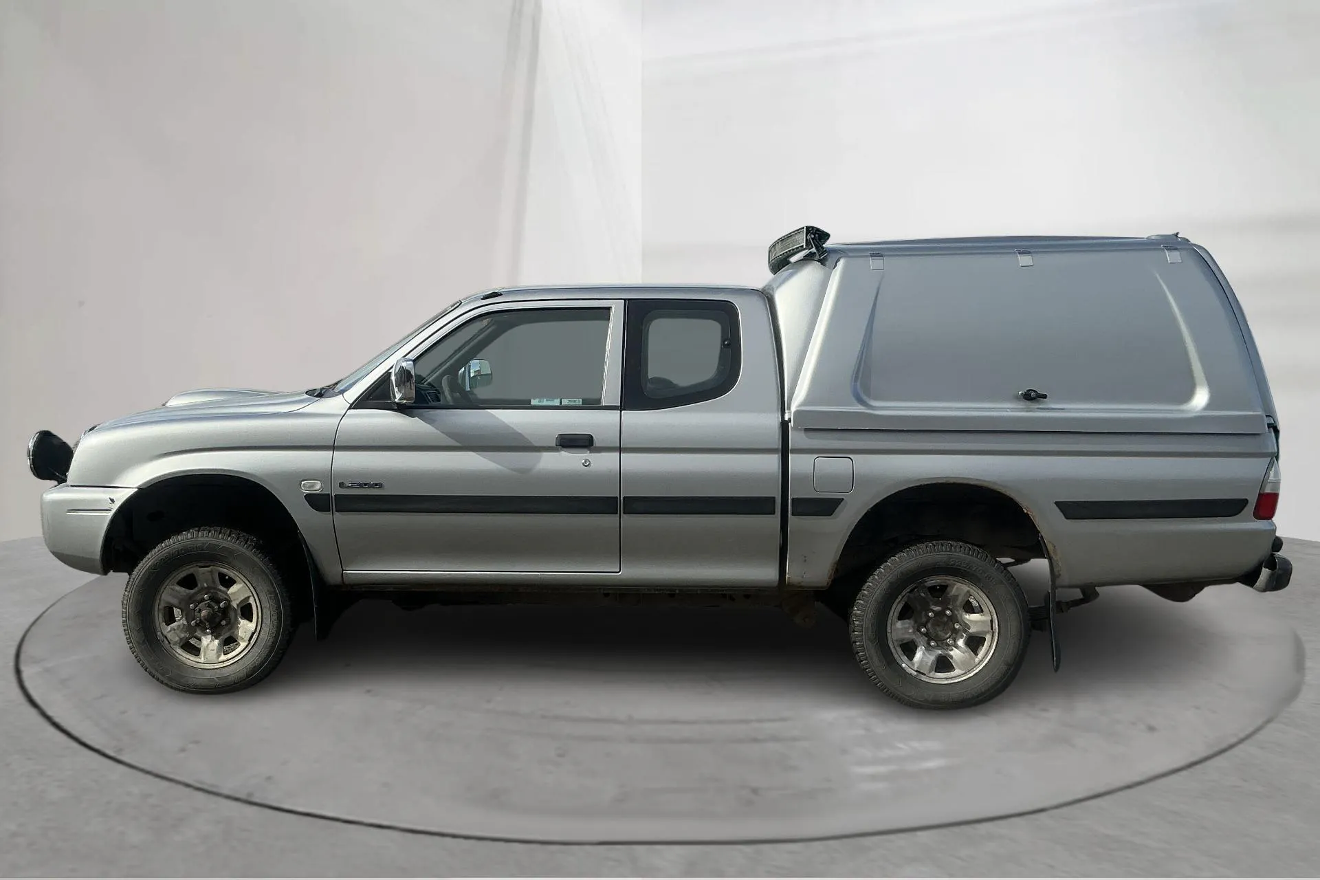 Presentationsfoto 2 av 14: Mitsubishi L200 2.5 TD 4WD (115hk) - 18 760 mil - Manuell - silver - 2002