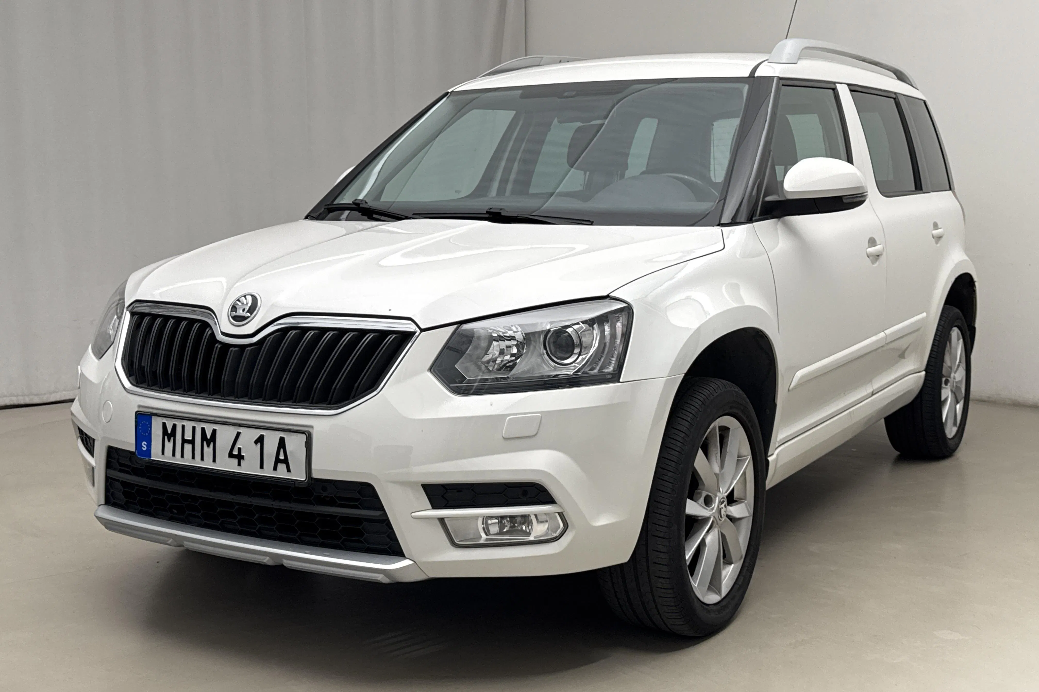 Presentation photo 1 of 15: Skoda Yeti 1.2 TSI (105hk) - 118 330 km - Manual - white - 2015