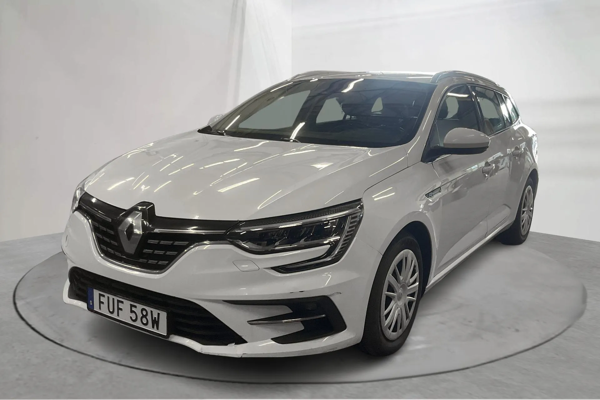 Presentationsfoto 1 av 13: Renault Mégane 1.5 dCi Sport Tourer (115hk) - 33 412 mil - Automat - vit - 2021