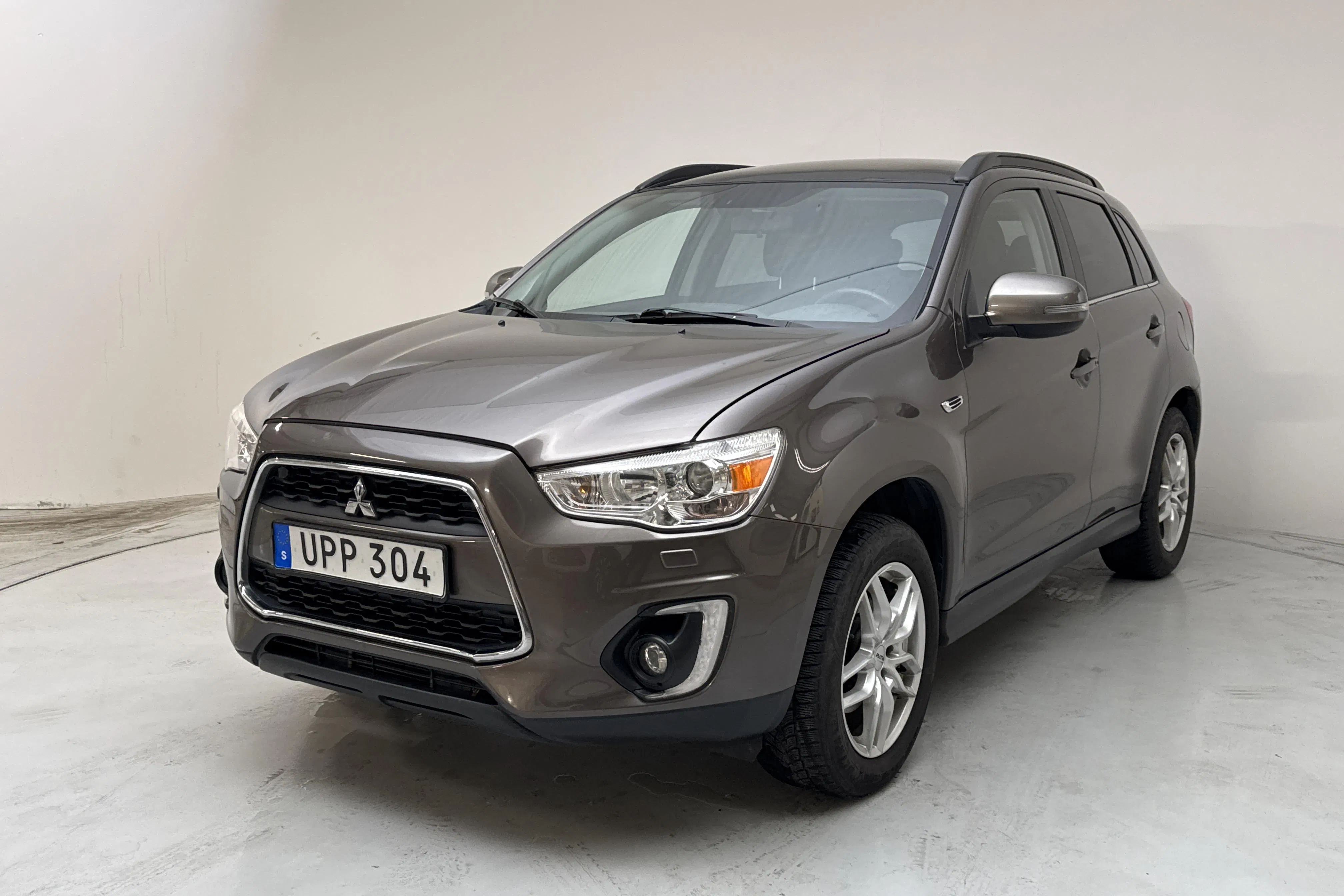 Presentationsfoto 1 av 14: Mitsubishi ASX 2.2D 4WD (150hk) - 16 874 mil - Automat - brun - 2015