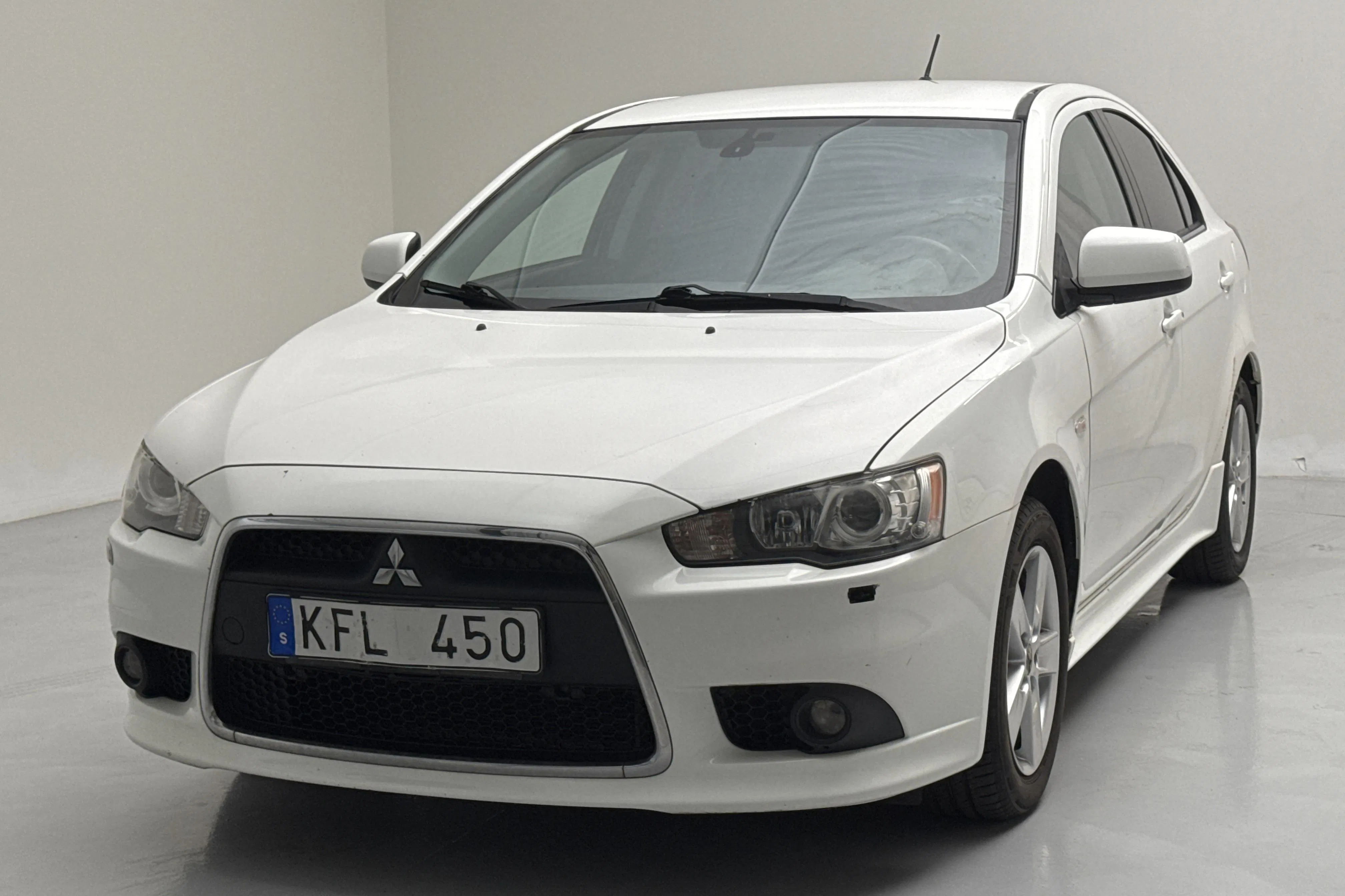Presentationsfoto 1 av 12: Mitsubishi Lancer 1.8 FFV (140hk) - 13 480 mil - Manuell - vit - 2010