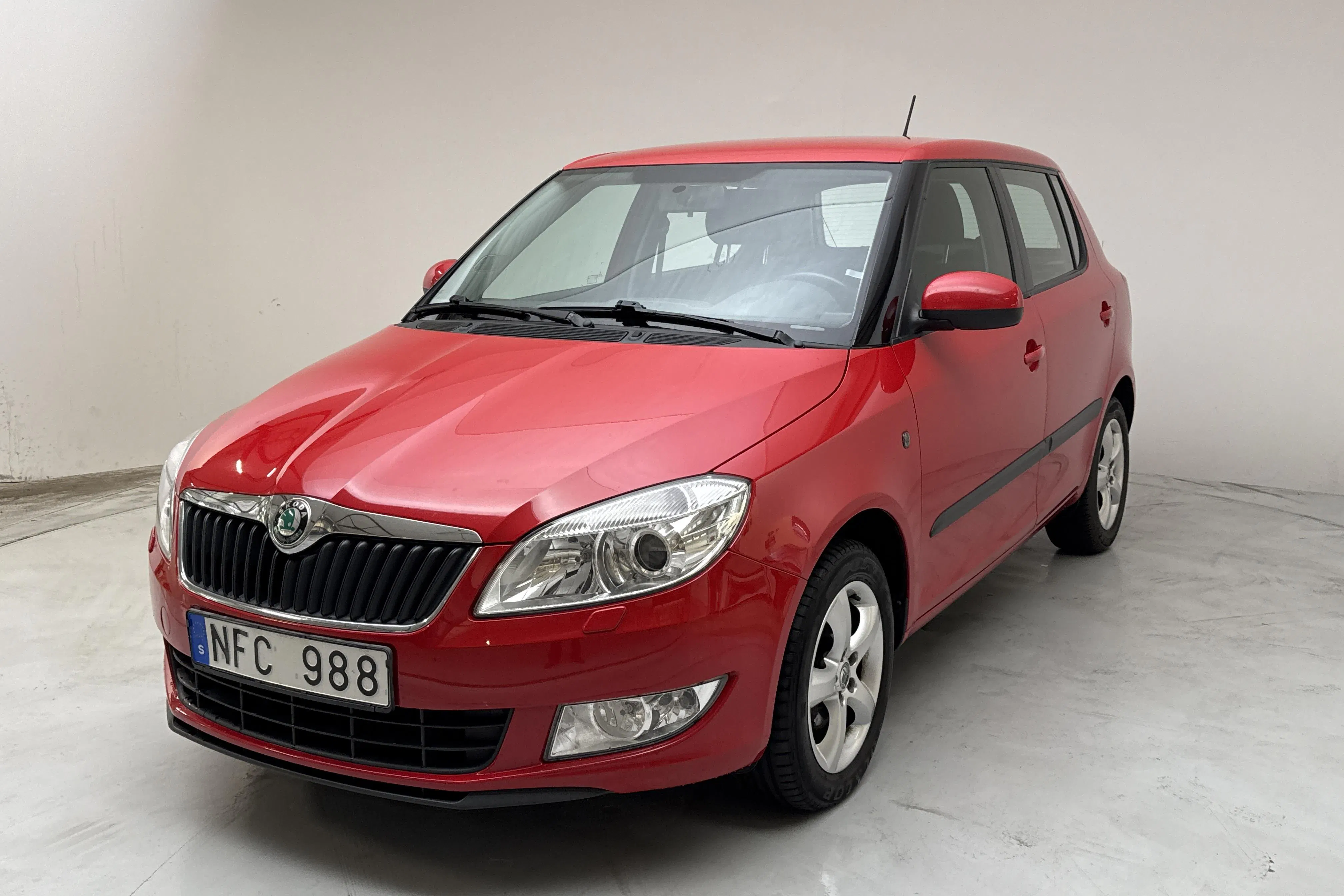 Presentation photo 1 of 12: Skoda Fabia 1.2 TSI (86hk) - 105 840 km - Manual - red - 2013