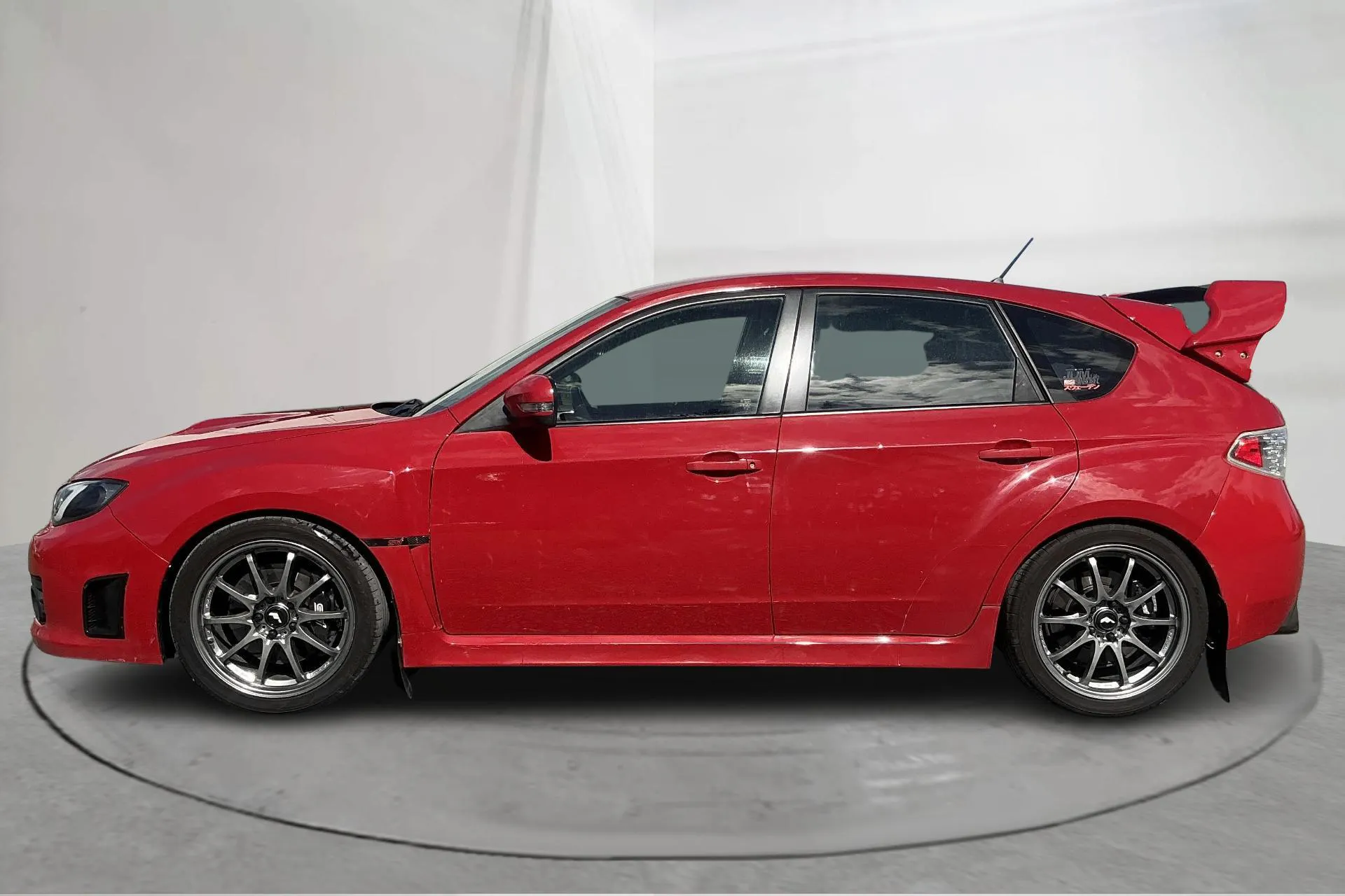 Presentationsfoto 2 av 18: Subaru Impreza 2.5 WRX STI (300hk) - 12 367 mil - Manuell - röd - 2010