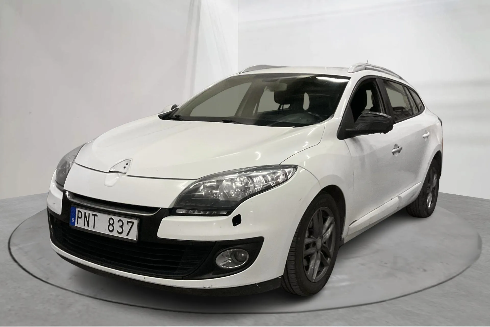 Presentation photo 1 of 13: Renault Mégane Phas III 1.5 dCi Sports Tourer (110hk) - 176 730 km - Automatic - white - 2013