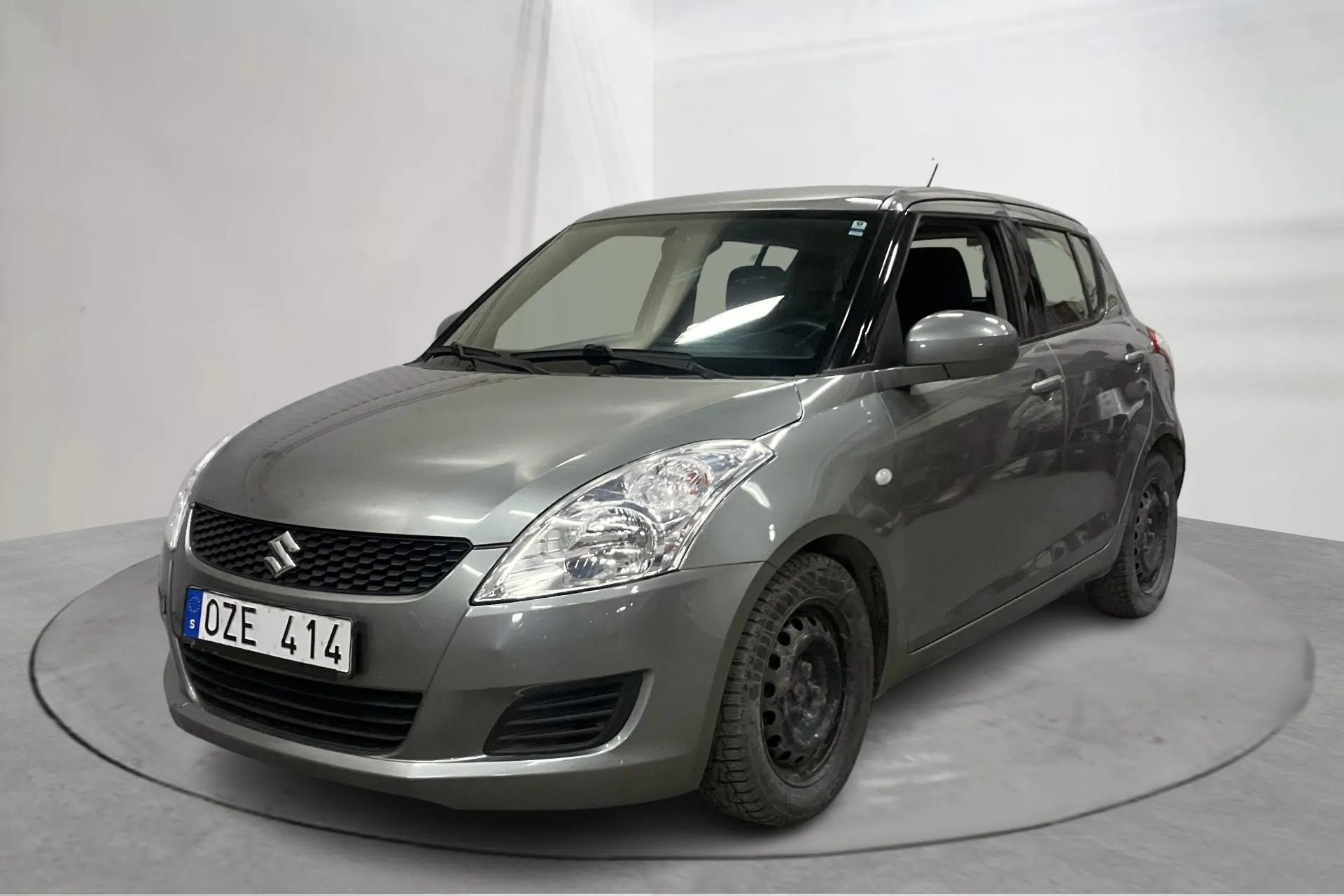Presentationsfoto 1 av 12: Suzuki Swift 1.2 5dr (94hk) - 9 369 mil - Automat - grå - 2013