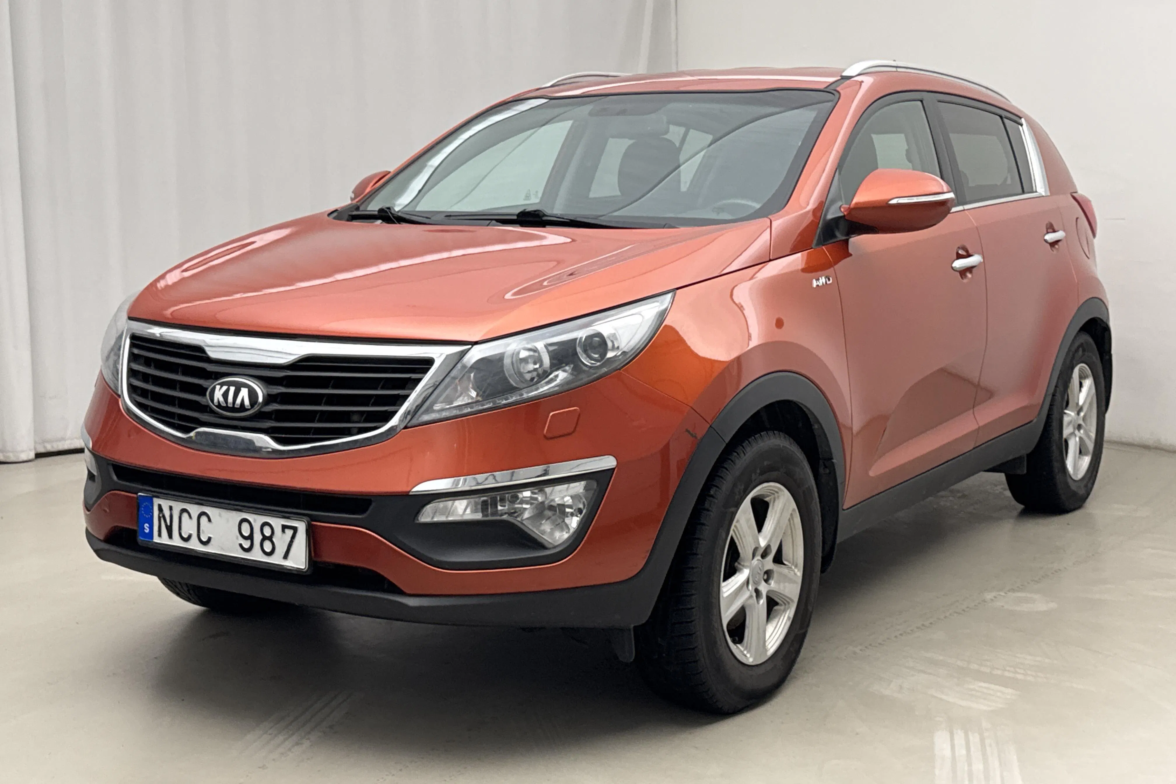Presentationsfoto 1 av 15: KIA Sportage 2.0 CRDi AWD (184hk) - 21 851 mil - Manuell - röd - 2013