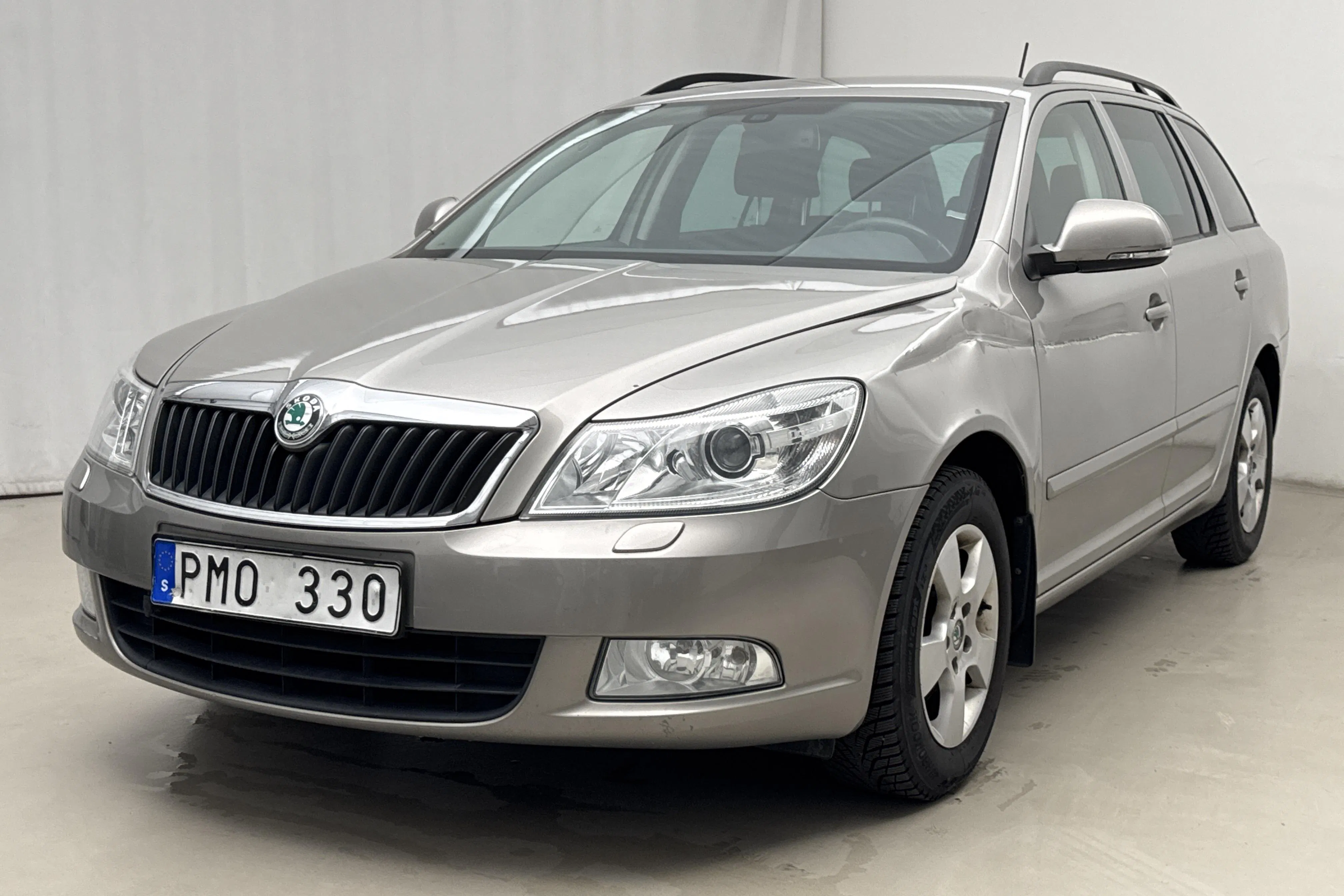 Presentationsfoto 1 av 14: Skoda Octavia II 1.4 TSI Kombi (122hk) - 13 426 mil - Automat - Ljusbrun - 2013