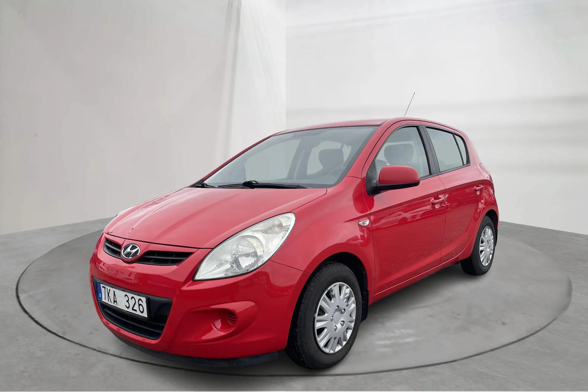 Presentationsfoto 1 av 14: Hyundai i20 1.2 (78hk) - 14 117 mil - Manuell - röd - 2011